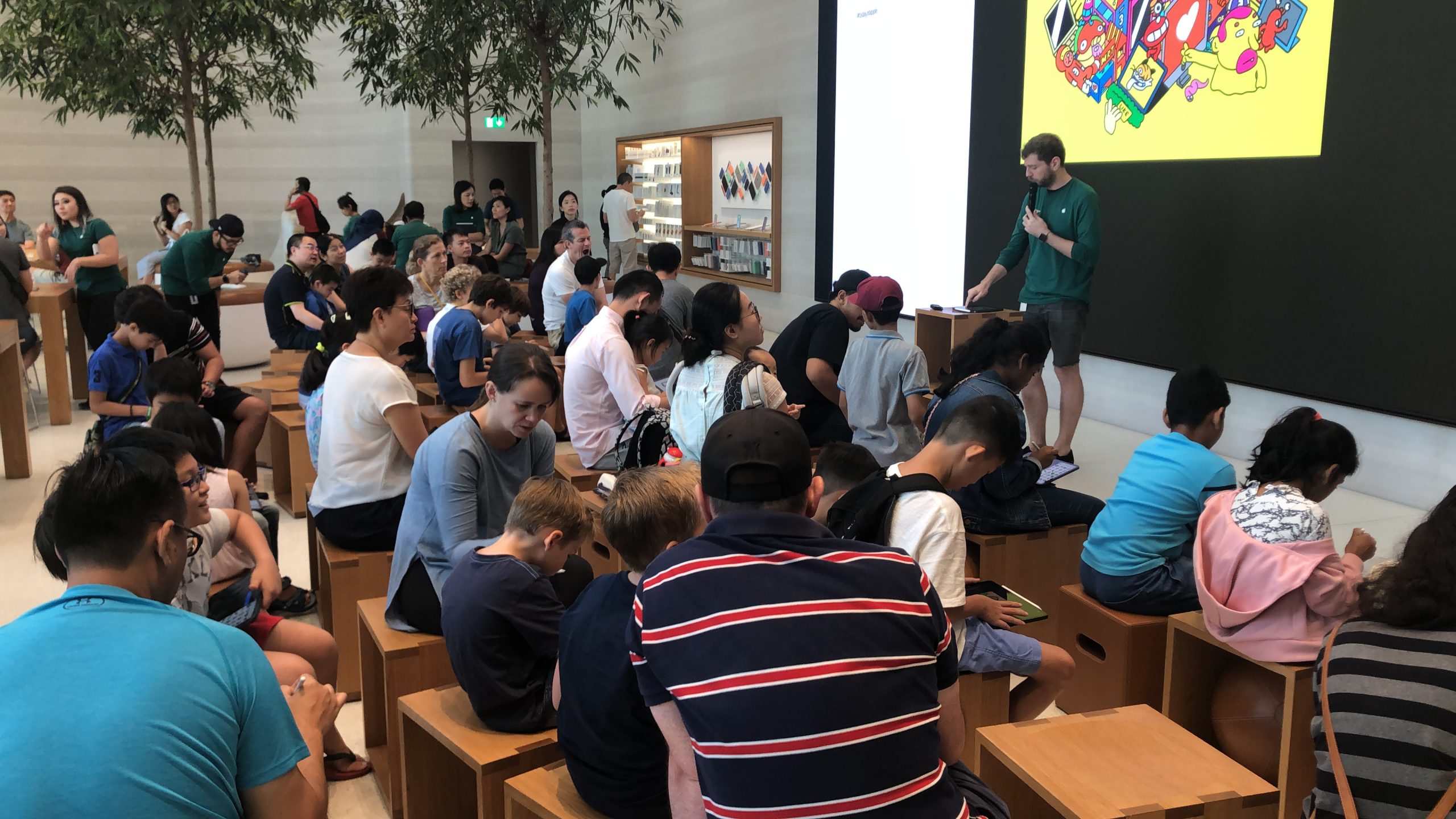 Digital collage workshop participants at the Apple store in Orchard